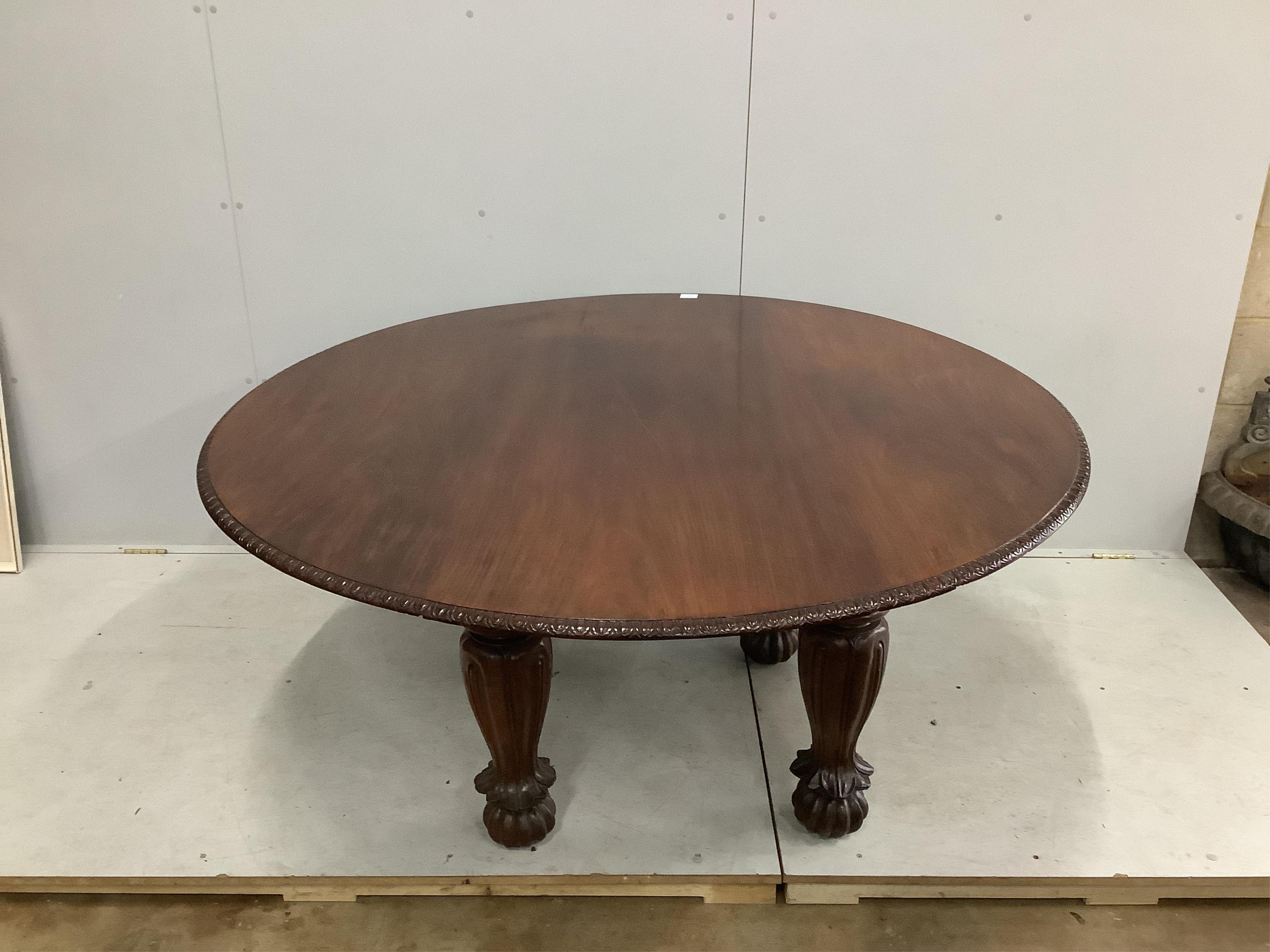 An Indian padouk wood circular top dining table, diameter 152cm, height 74cm. Condition - table has seen some reconstruction, repolished and now good condition